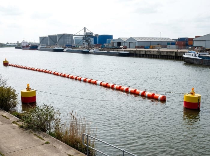 High visibility floating boom barrier on river